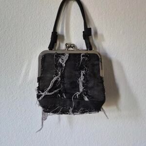 Lowsh distressed jean kisslock purse